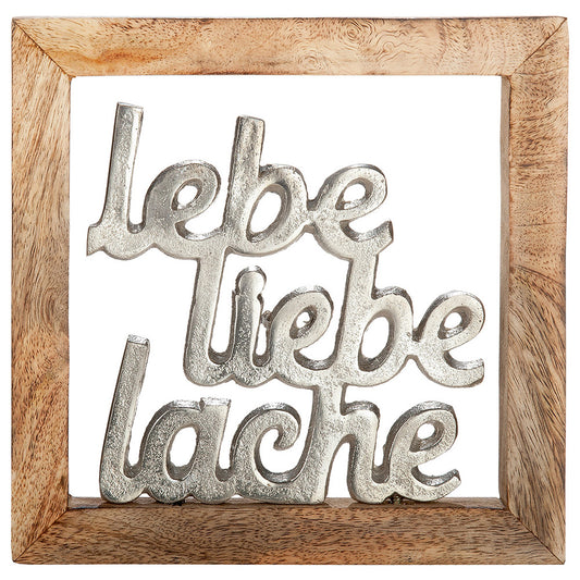 Rahmen-Wandbild "Lebe, Liebe, Lache" aus Aluminium und Mango Holz. Brauner Holzrahmen in dem der silberne Schriftzug lebe, liebe, lache befestigt ist. Zum Hängen aber auch zum Stellen geeignet.