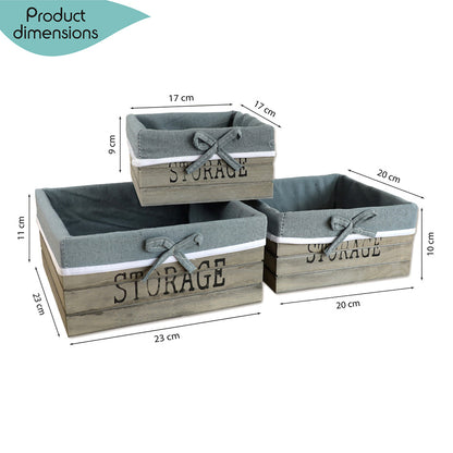 aufbewahrungskörbe aus braunem holz mit der aufschrift storage und mit grauer leinenstoffeinlage. 3er set in drei unterschiedlichen größen, rechteckig ohne deckel
