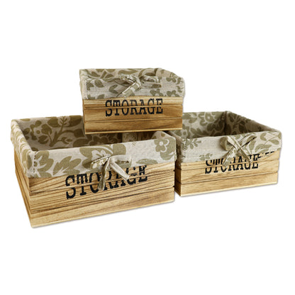 aufbewahrungskörbe aus braunem holz mit der aufschrift storage und mit beige gemusterter leinenstoffeinlage. 3er set in drei unterschiedlichen größen, rechteckig ohne deckel