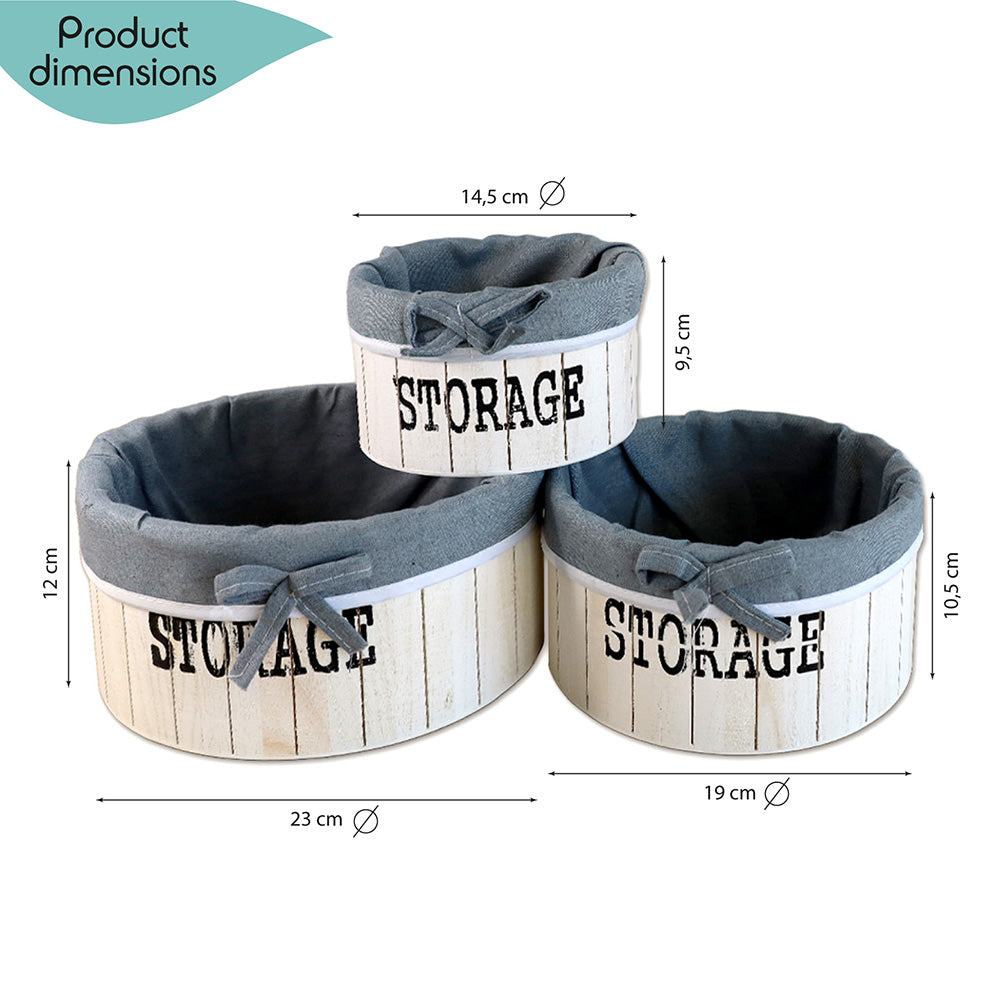 aufbewahrungskörbe aus weißem holz mit der aufschrift storage und mit grauer leinenstoffeinlage. 3er set in drei unterschiedlichen größen, rund ohne deckel