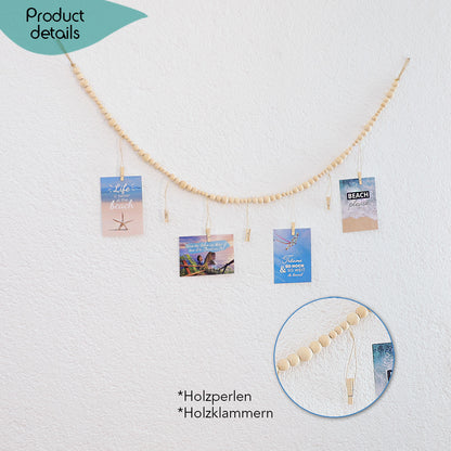 DECCARO Fotoaufhänger Cord, Fotoaufhänger aus einer hellen horizontalen Baumwollschnur auf die hellen Holzperlen aufgereiht sind. An dieser Schnur sind sechs vertikal ausgerichtete Baumwollschnüre mit Holzperlen und kleinen Holzklammern befestigt, an den Fotos und Postkarten aufgehangen werden können. 